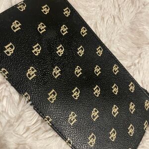 Dooney & Bourke Black and Gold Clutch
